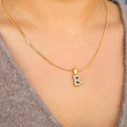 PEARL LETTER PENDANT.